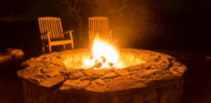 Use a fire pit kit to create a winter gathering place.