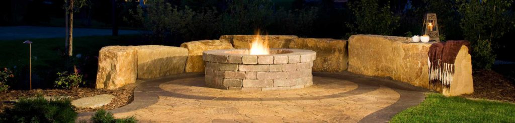 Natural stone firepit with semi-circular wall
