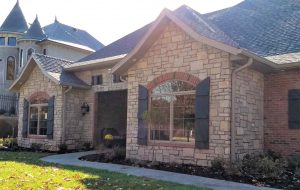 Nice home in Columbia, MO with natural stone veneer and brick facings.