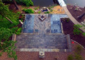 Patio designed with stone landscape pavers in an attractive pattern.