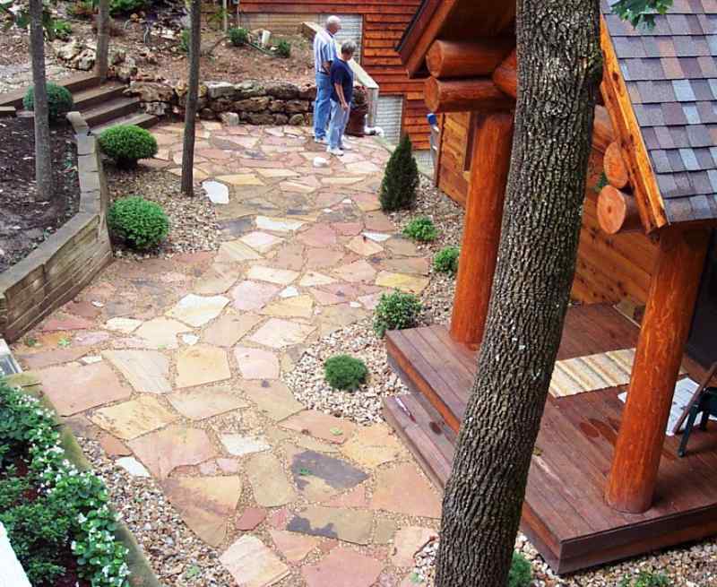 Colorful flagstone walkway in front of a log cabin at Lake of the Ozarks!