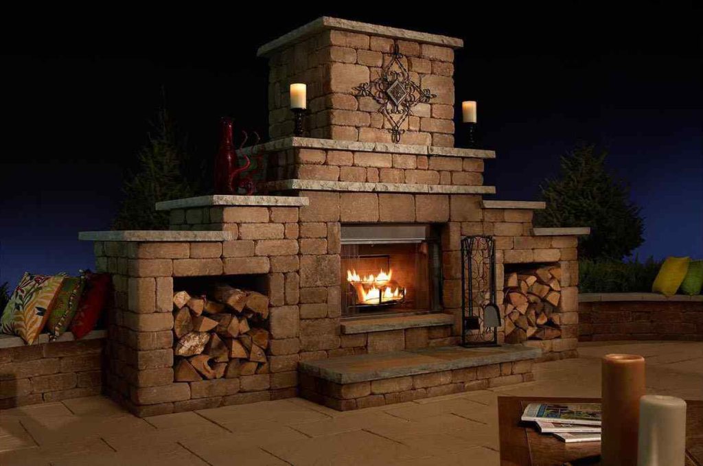 Grand DIY fireplace kit fully assembled on a nice patio against an evening sky