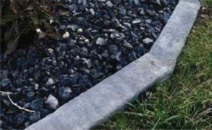 Rosetta Bordo edging brings definition and containment to some dark landscaping rock