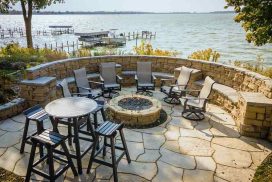 Rosetta Grand Flagstone used as patio pavers with a stone seating wall by the lake