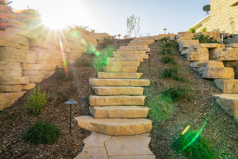 Beautiful irregular stone steps and retaining walls by Rosetta Hardscapes