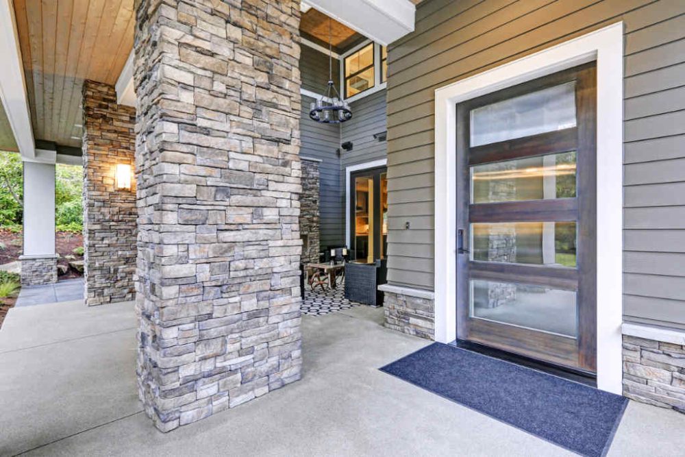 large veneer posts at exterior entrance