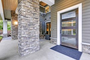large veneer posts at exterior entrance