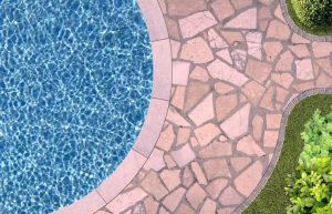 Swimming pool and flagstone patio in top view