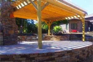 Patio using natural stone with a pergola covering it